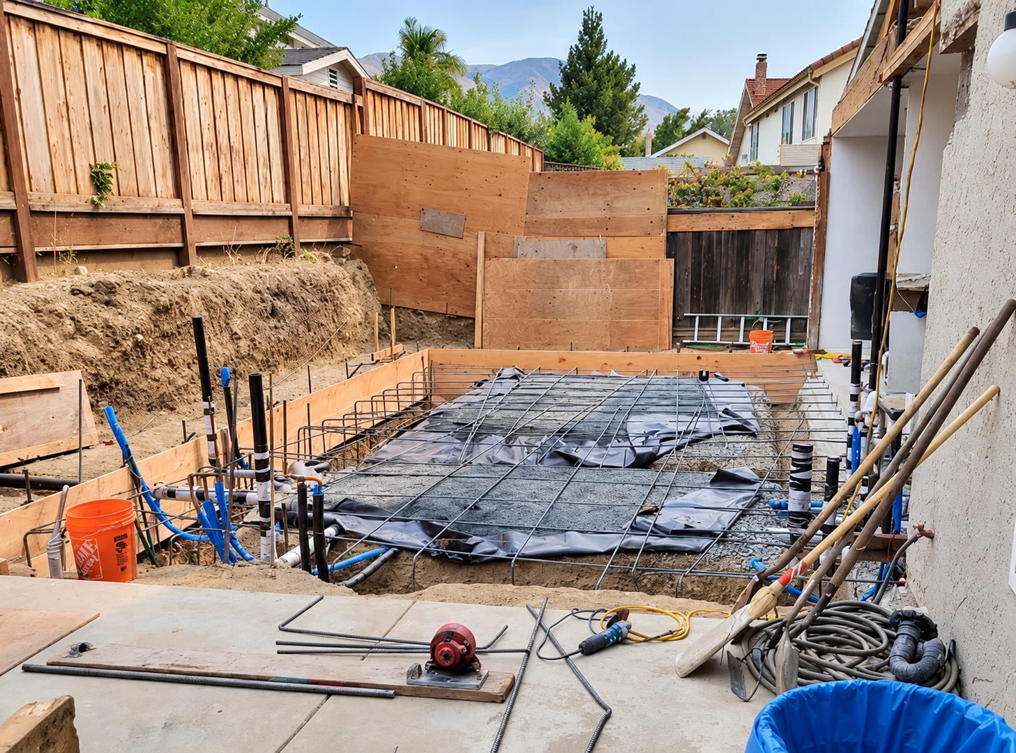 Foundation preparation with reinforcement and plumbing rough-ins