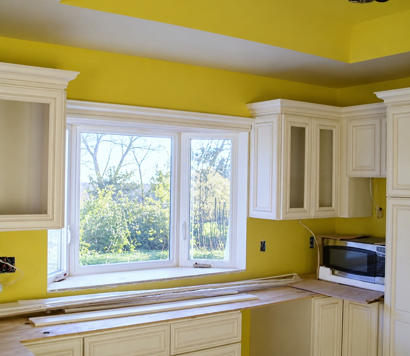 Kitchen cabinetry and window trim during installation
