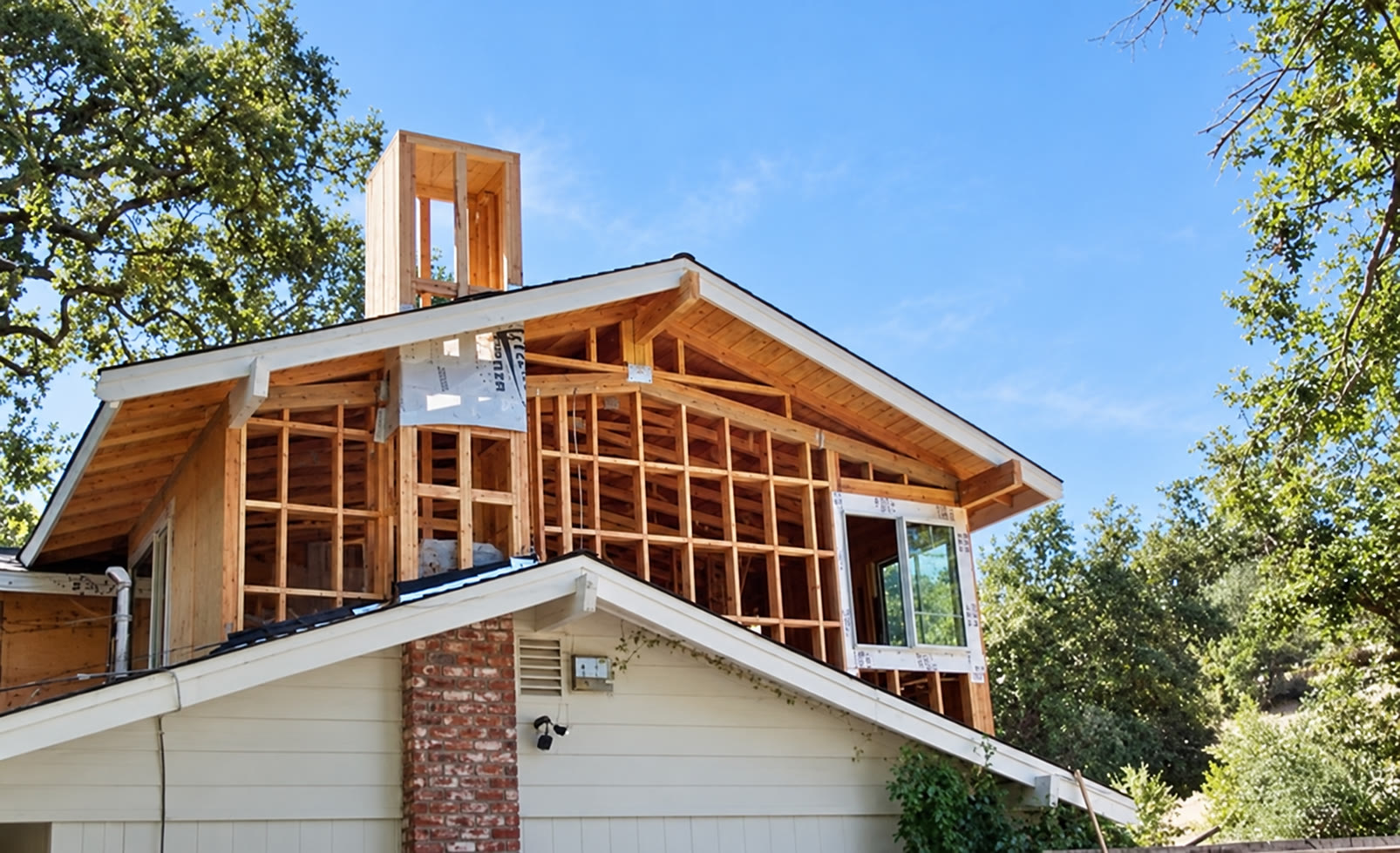 Upper-story residential addition with exposed framing