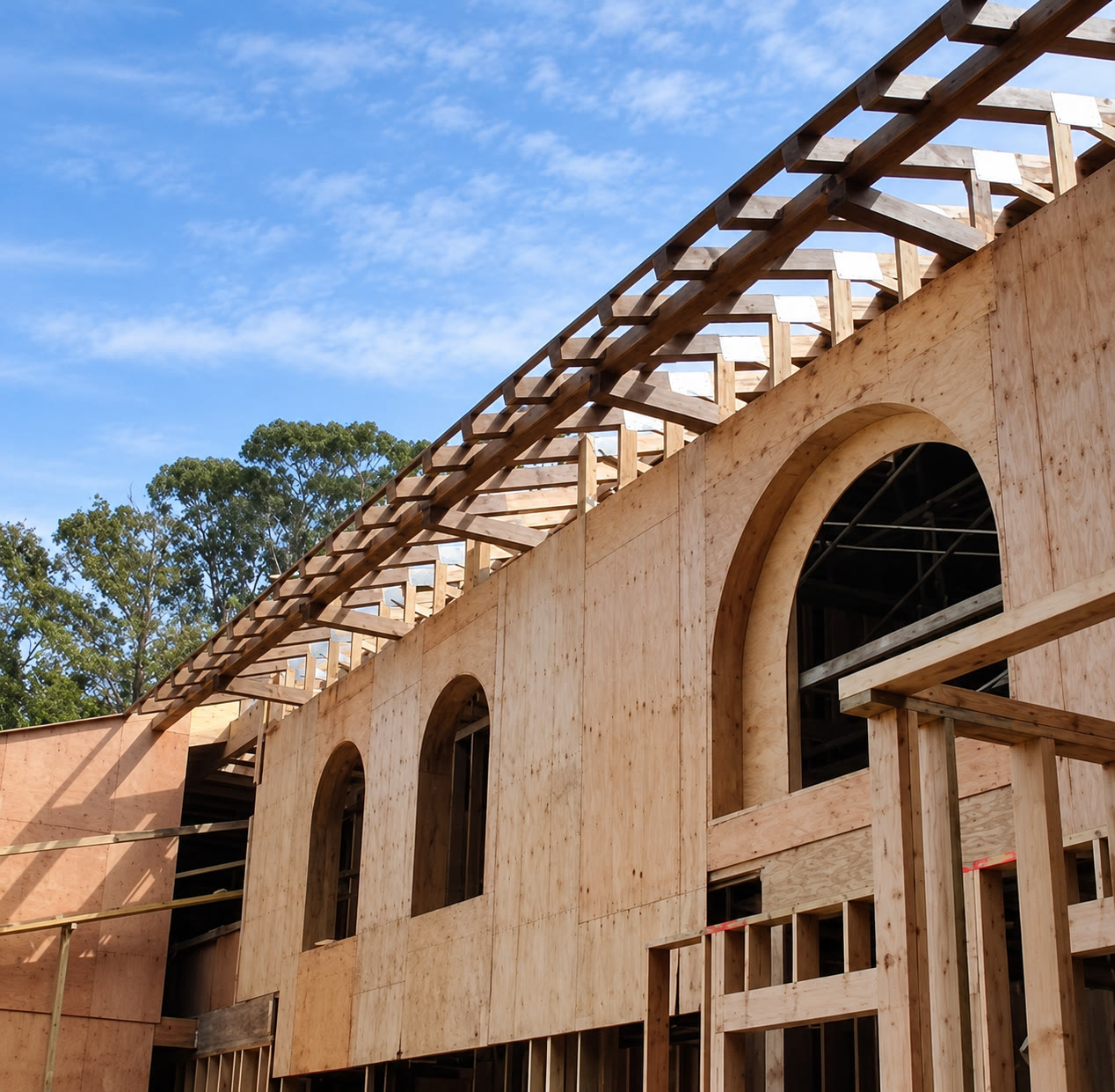 Arched exterior openings and exposed roof framing