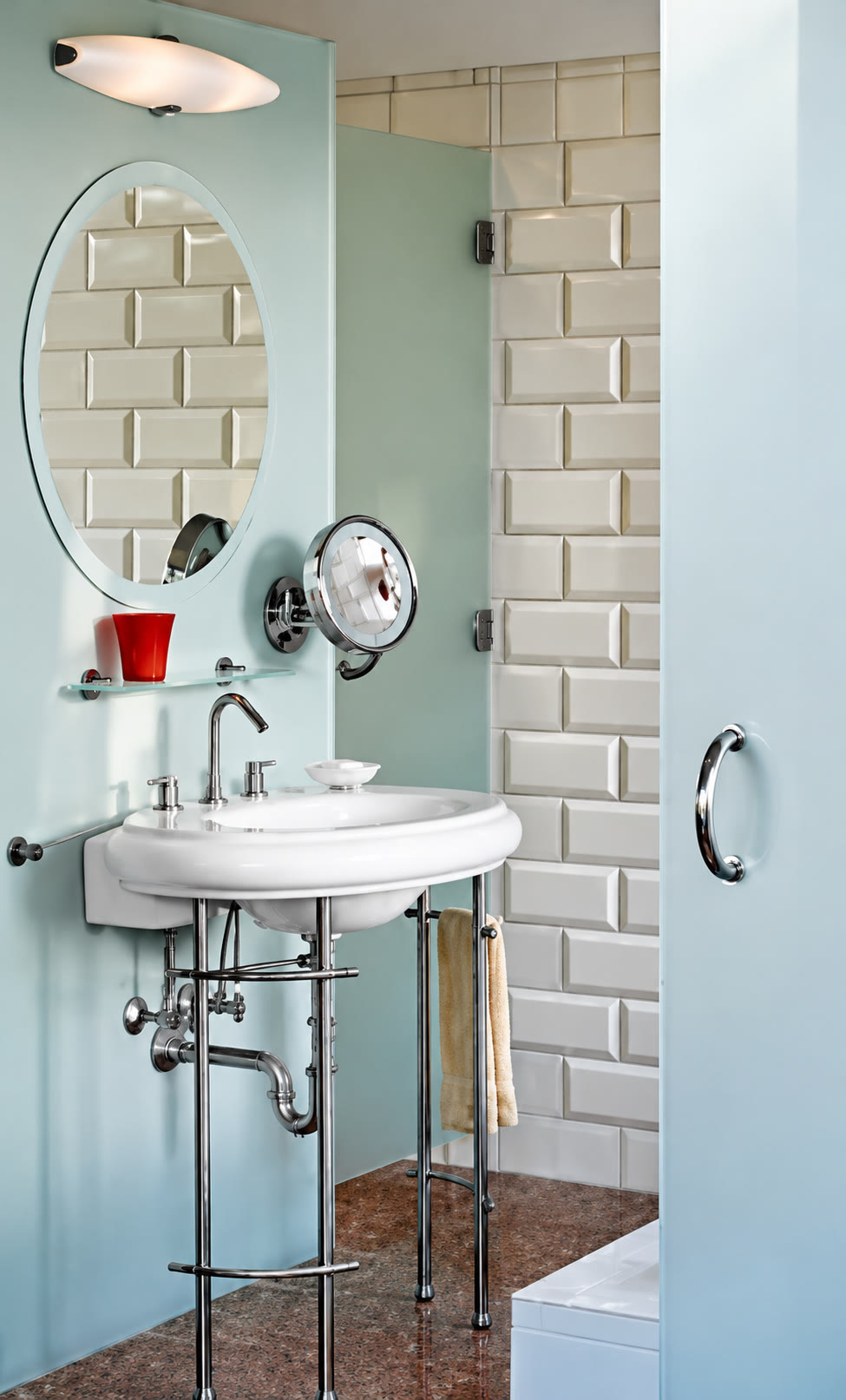 Bathroom vanity with polished chrome fittings and beveled tile